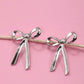 Dangling Silver Bow Earrings